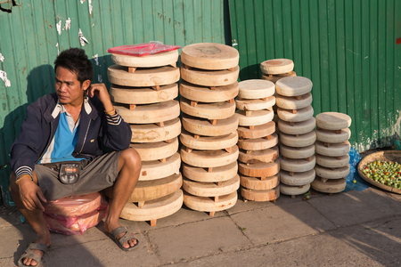 Vientian - Laos - January 17 ;Lao vendor sell chopping block on street at morning market . This market sell equipment made from local product on January 17,2016. Vientian , Laos.のeditorial素材