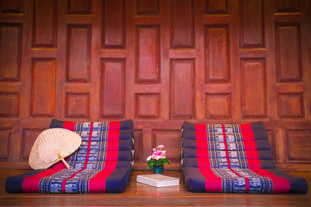 Triangle pillow seat with book , Thai traditionの写真素材