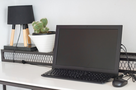 Selective focus computer desktop with decoration on white tableの写真素材
