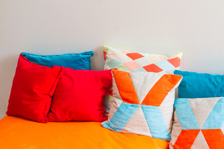 Another color pillows on a sofaの写真素材