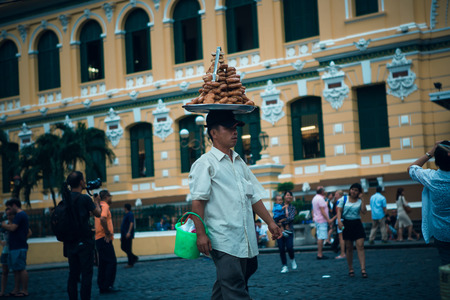 HO CHI MINH, VIETNAM-NOVEMBER 07. 2016: Street food vendor in the street of Ho Chi Minh on Noveber 04, 2016, Vietnam. Estimate 10.6% of Vietnam's population is below the poverty line.のeditorial素材