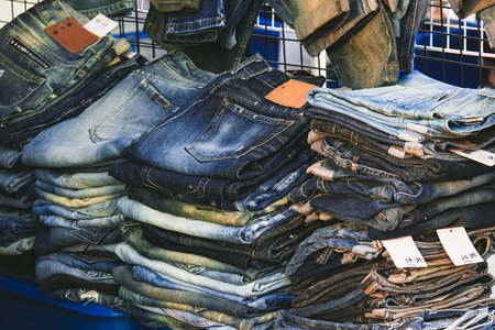 Jeans trousers stack closeup in marketの写真素材
