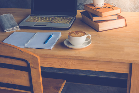 the office working place at morning. Coffee with laptop  glasses, notebook and  penの写真素材