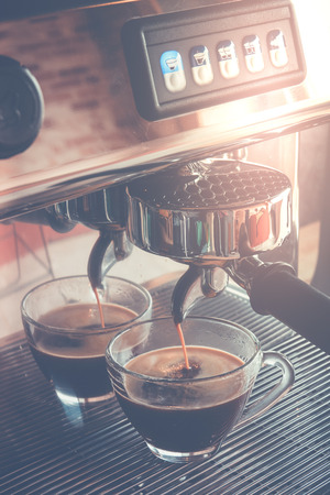 Espresso machine making coffee in cafeの写真素材