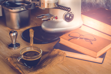 Cup of coffee on table of coffee makerの写真素材