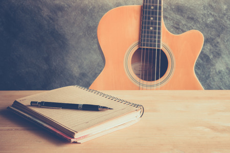 Guitar with blank page for composing and creativity musicの写真素材