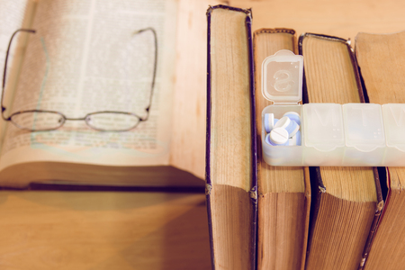 Education and health concept,A man hard study and reading, he headachesの写真素材