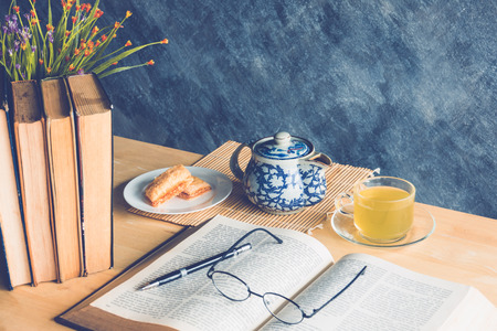 Still life tea time with  books on tableの写真素材