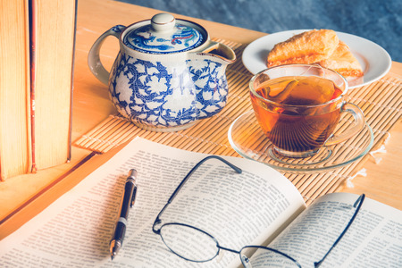 Still life tea time with  books on tableの写真素材