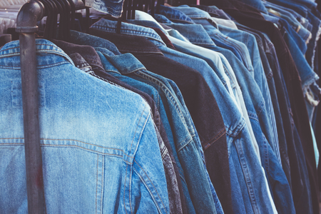 Close up jean shirt on rack in marketの写真素材