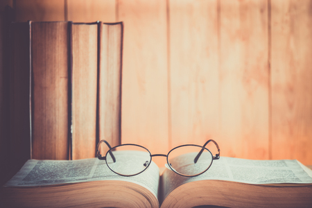 Book and Glasses with wood backgroundの写真素材