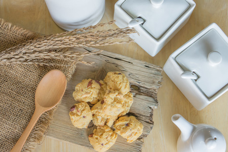 Still life of cookie with nut on woodの写真素材