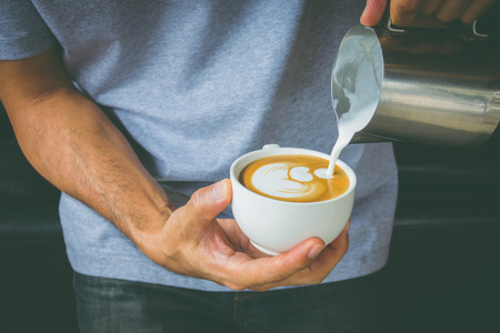 How to make latte art coffee by Baristaの写真素材