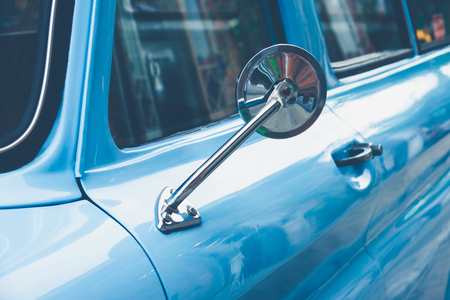 Vintage classic car with back of mirrorの写真素材