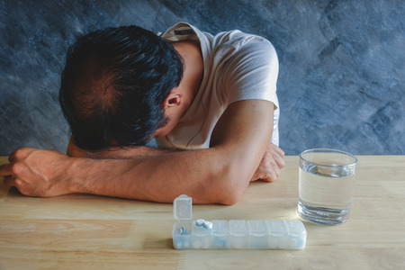 Education and health concept,A man hard study and reading, he   headachesの写真素材