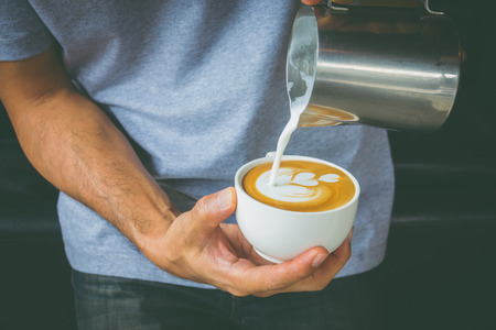 How to make latte art coffee by Baristaの写真素材