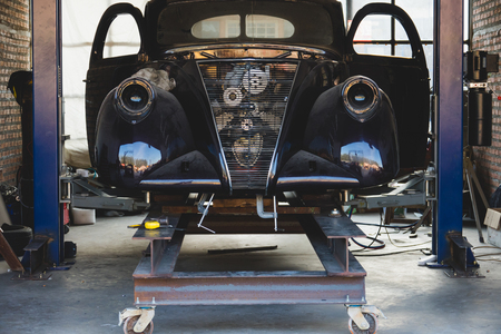 Vintage garage with classic car revive.の写真素材