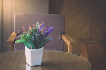 Vintage flower on table with luxury chairの写真素材