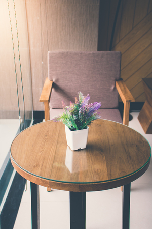 Vintage flower on table with luxury chairの写真素材