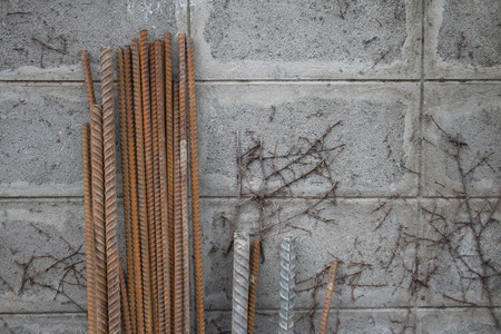 Steel Rebar with brick wall backgroundの写真素材
