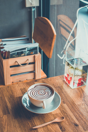 Hot chocolate on wood bar in cafeの写真素材