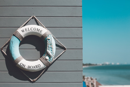 Decoration life ring with "Welcome aboard" word decorate on wallの写真素材