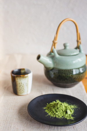 Set of matcha powder dish with tea pot and small tea cupの写真素材