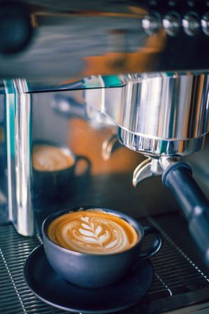 Latte art coffee with coffee machineの写真素材