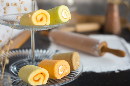 Rolling pin and white flour with bakery on glassの写真素材