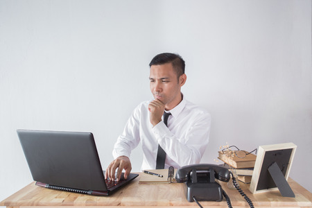 a young business man looking depressed and worried from work at meeting office indorsの写真素材