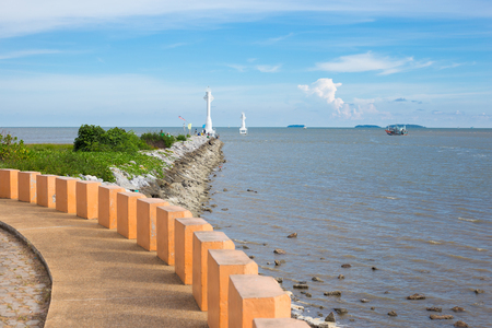 Seascape of Rayong , Thailand , beach and light house with fishermanの写真素材