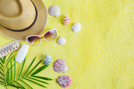Summer holiday background, Beach accessories on yellow texture, Vacation and travel itemsの写真素材