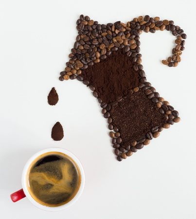 Coffee beverage concept , Moka pot shape made from coffee bean with coffee ground ,white background with copy spaceの写真素材