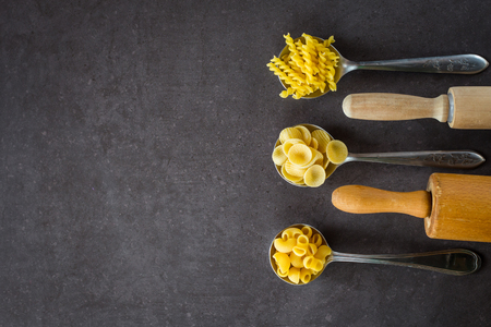 Various pasta spoons. Cooking concept. Top view with space for your recipeの写真素材