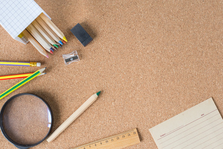 Creative flat lay mockup design of school desk with note paper and pencils and space for your textの写真素材