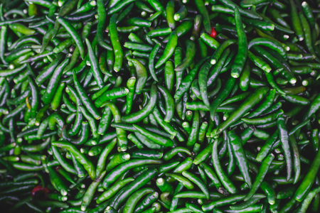 Green pepper or chili on gourmet market , background for recipe your businessの写真素材
