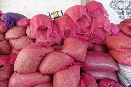 Large bags a raw coffee beans, Coffee bean sorting and processing in a factoryの写真素材