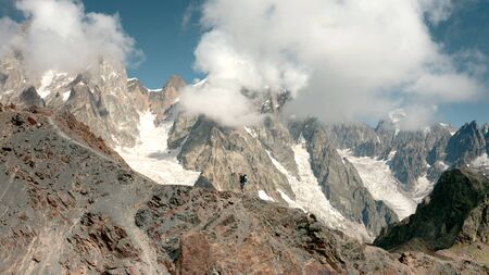 Man on the background of Ushba. View from the droneの写真素材
