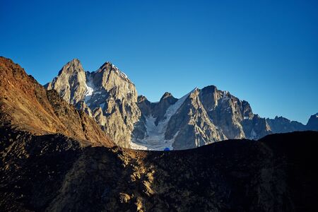 Tent on the background of Ushba. Dawn in the mountains of Svanetiの写真素材