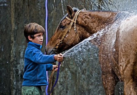 MONTEVIDEO , URUGUAY  - APRIL 11 2009 :  participant child  in the Gauchos show in Semana Criosaのeditorial素材