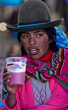 Cusco , Peru - May 27 : Peruvian woman drink のeditorial素材