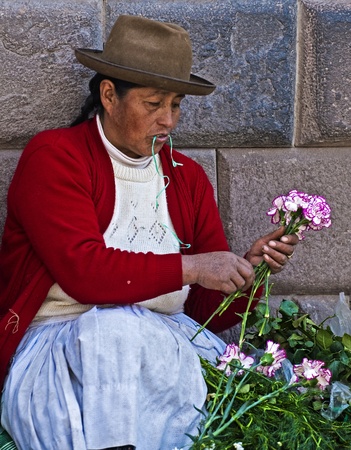 Cusco , Peru - May 27 : Peruvian woman in a market in Cusco Peru , May 27 2011のeditorial素材