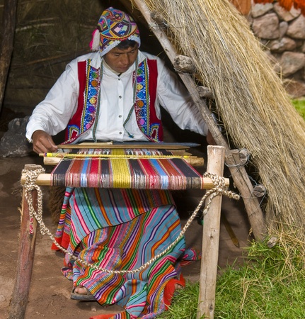 Cusco , Peru - May 26 2011 : Quechua Indian woman weaving with strap loomのeditorial素材