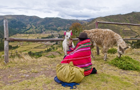 SACRED VALLEY,  PERU - MAY 27 : Unidentified Peruvian woman in traditional colorful clothes seat...