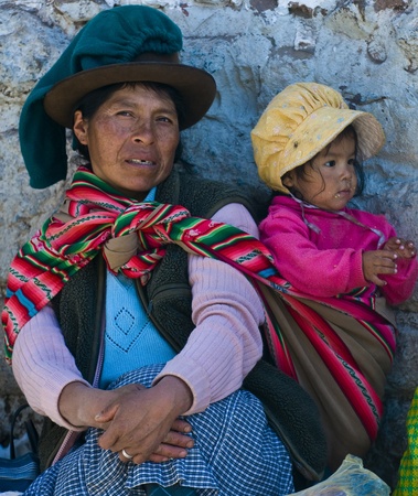 Cusco , Peru - May 28 2011 : Peruvian woman with here child in a market in Cusco Peruのeditorial素材