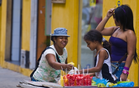 CARTAGENA DE INDIAS , COLOMBIA - DEC 21:Unidentified colombian woman sell fruits in the street in Cartagena de Indias on December 21 2010のeditorial素材