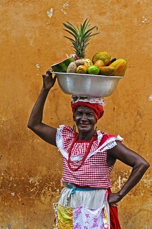 CARTAGENA DE INDIAS , COLOMBIA - DEC 21:Unidentified Palenquera woman sell fruts in Cartagena de Indias on December 21 2010,Palenqueras are  a unique African descendat ethnic group found in the north region of South Americaのeditorial素材