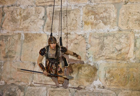 JERUSALEM - NOV 03 : An Israeli acrobat dressed as knight climbing on the old city walls in the annual medieval style knight festival held in the old city of Jerusalem on November 03 2011のeditorial素材