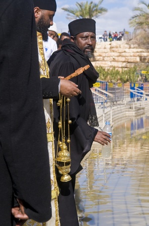 QASER EL YAHUD , ISRAEL - JAN 19 : Ethiopian Orthodox priest participates in the annual baptising ceremony during the epiphany at Qaser el yahud , Israel in January 19 2012のeditorial素材