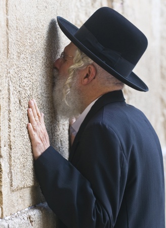 JERUSALEM - NOVEMBER 03 2011 - Orthodox jewish man prays in The western wall  , An Important Jewish religious site located in the Old City of Jerusalem , Israelのeditorial素材